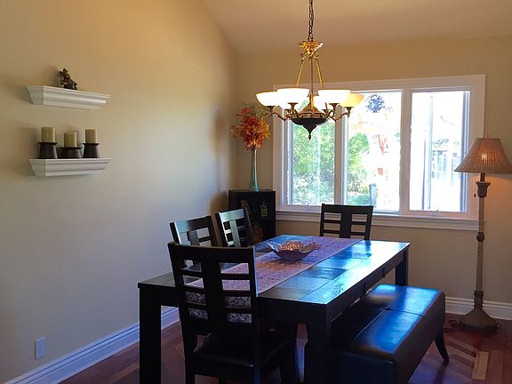 Formal Dining Room with Vaulted Ceilings & Bay windows with