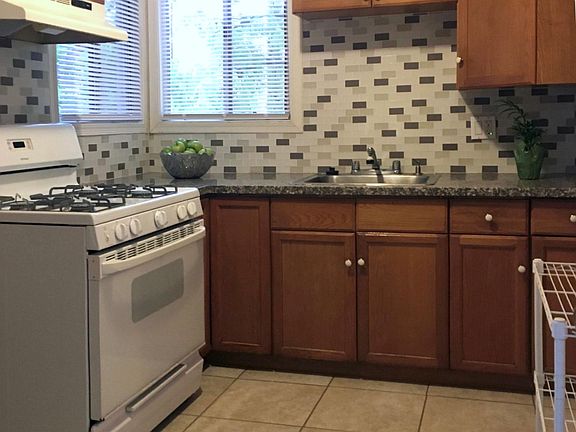 Granite Countertops with Glass Tile Backsplash