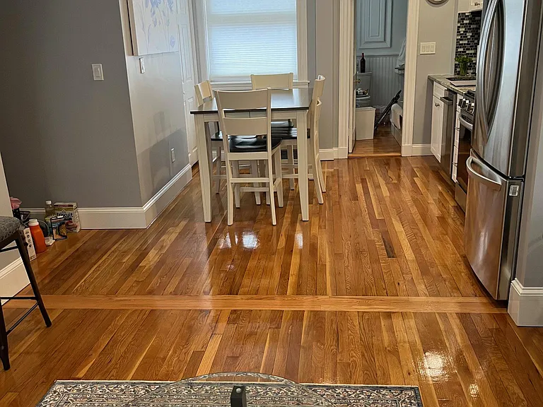View from living room into kitchen. Table seats 6.