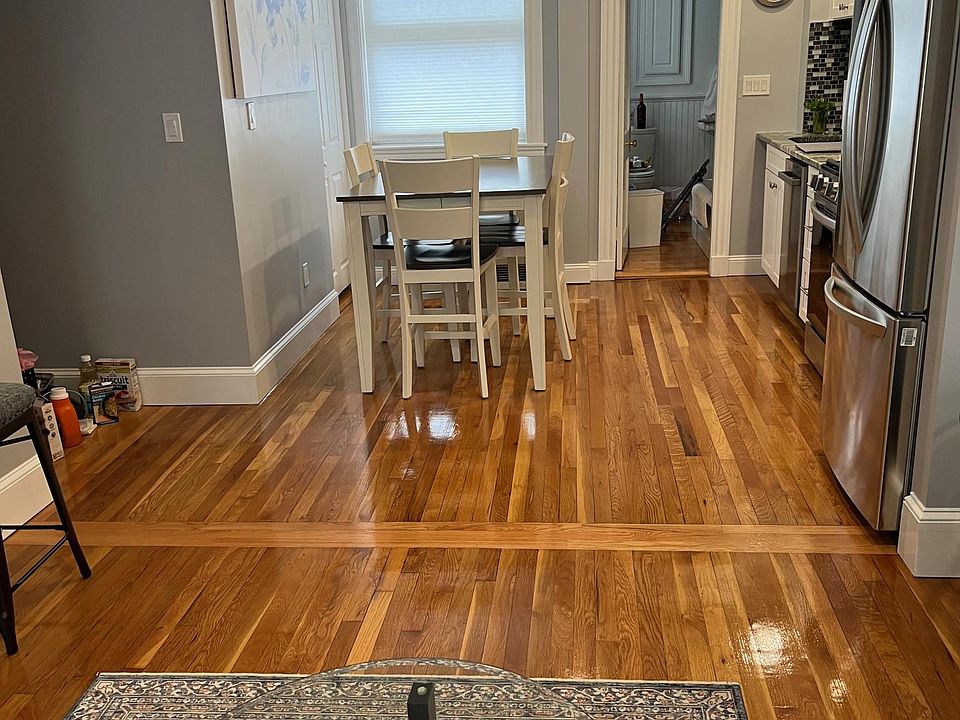 View from living room into kitchen. Table seats 6.