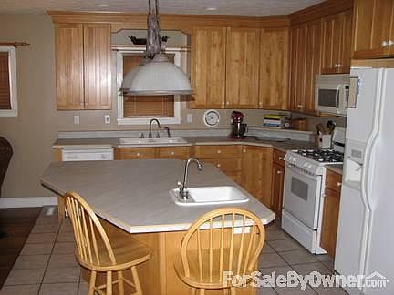Updated Kitchen
						:
						Beautiful cabinets, Large island with 2nd sink