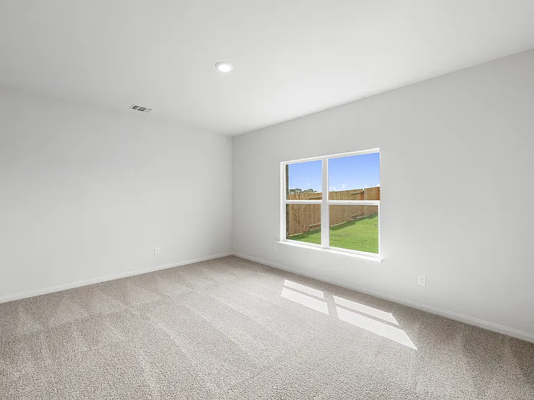 The master bedroom has a large window that lets in great, natural light.