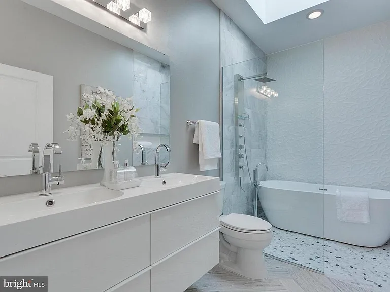 Master Bath: Dual vanities, Skylight, walk-in shower with freestanding tub