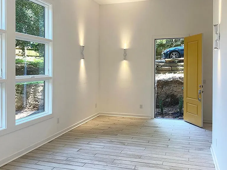 Looking back at the front door. Faux wood tile floors.