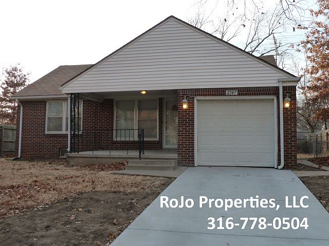 Front of house with new driveway,