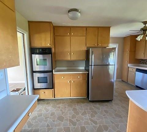 Kitchen - Built in double oven, stove top, refrigerator, dishwasher