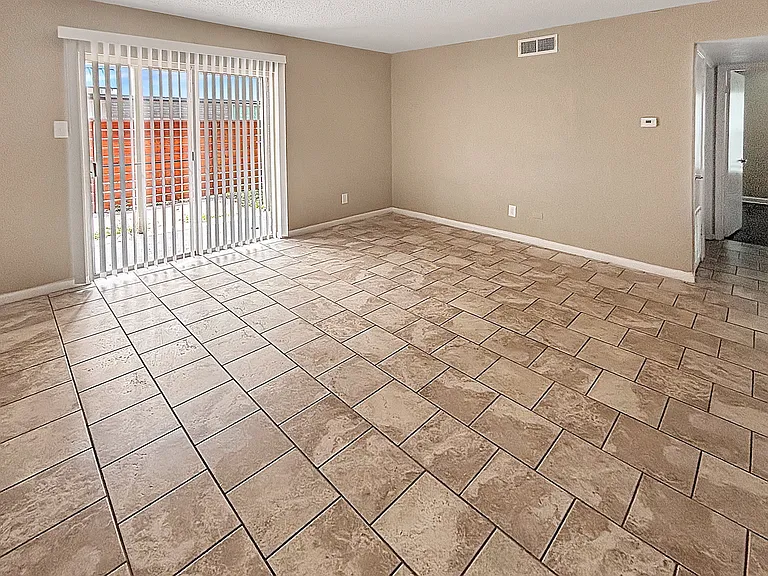 A bright living area with patio access at Christy Estates