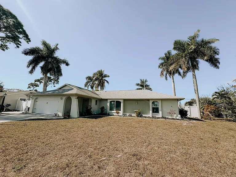 Front of the home. 2 car garage. Room for 3+ vehicles in the driveway.