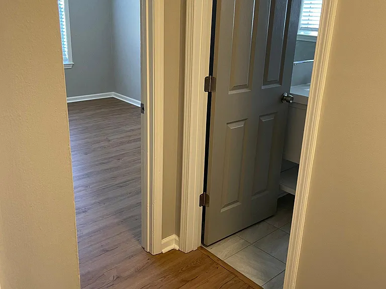 Hallway looking into third bedroom/ hall bath