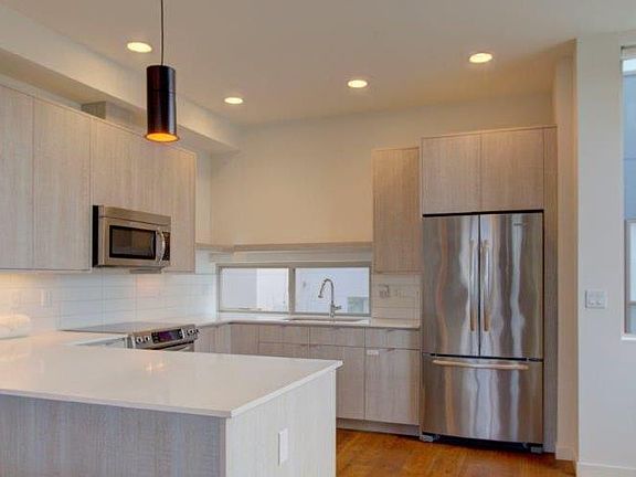 Modern kitchen with ample counter space including bar space 