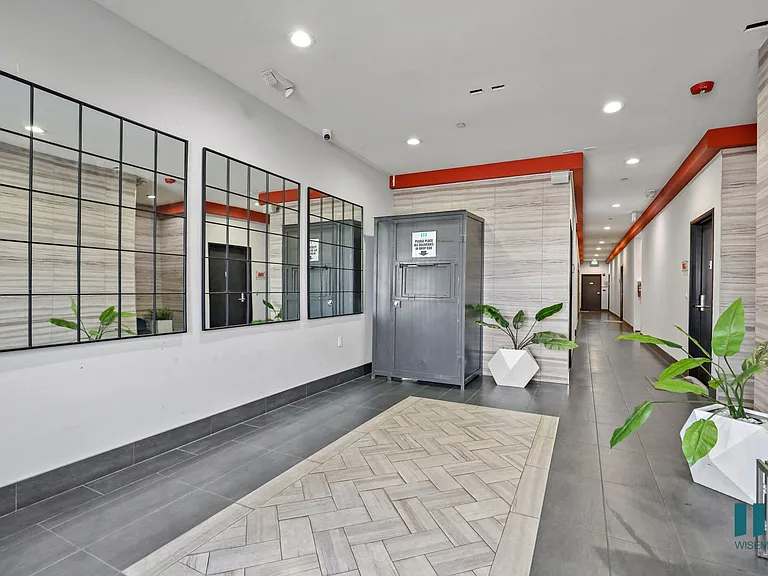 Lobby Area with Resident Package Locker and Elevator