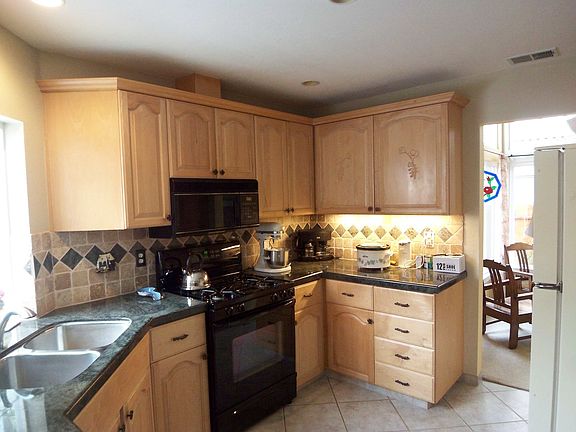Cook's kitchen with backyard views