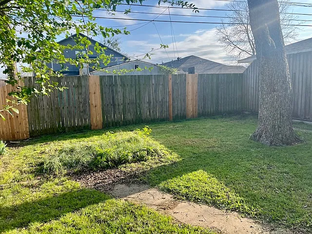 Shady, completely fenced in backyard