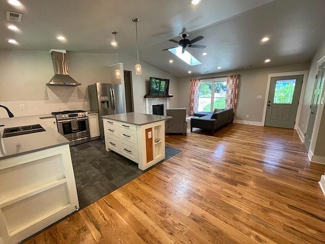 Bright open floor plan with quartz countertops and new appliances