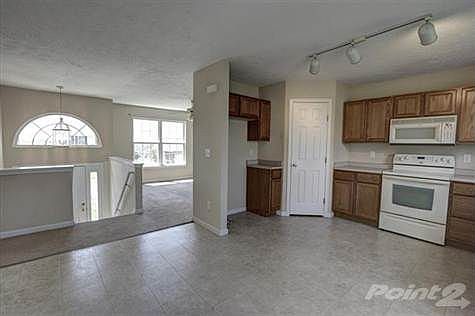The kitchen offers a dishwasher, microwave and oven/range with plenty of cabinets and counter tops. The pantry offers adequate space for storage. In addition, there is a walkout onto the oversized deck that overlooks the rear flat yard.