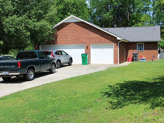 3 car garage and extra wide paved driveway