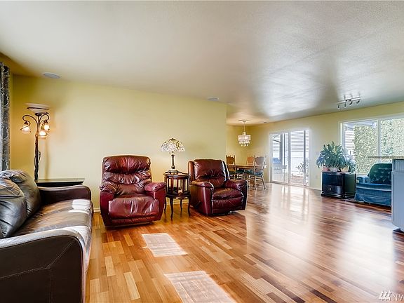 Another view from the entrance to the living room and open but distinguished dining space in the corner.