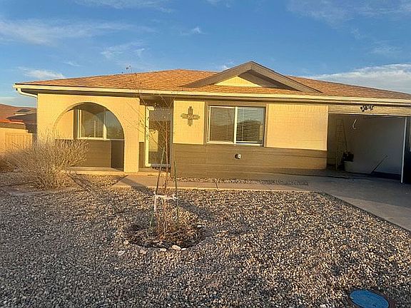 front w/birch tree & garage