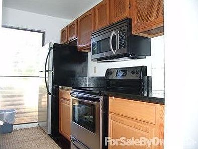 Kitchen : Kitchen has stainless steel and back granite.