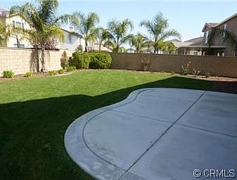 Large Back Yard With Concrete Patio