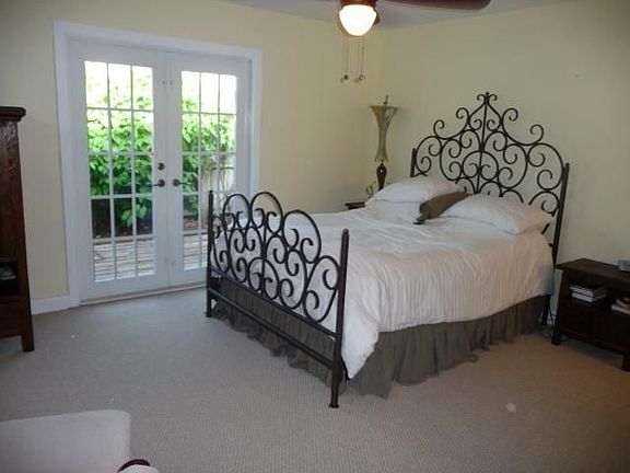 Master BR with french doors leading to wood deck