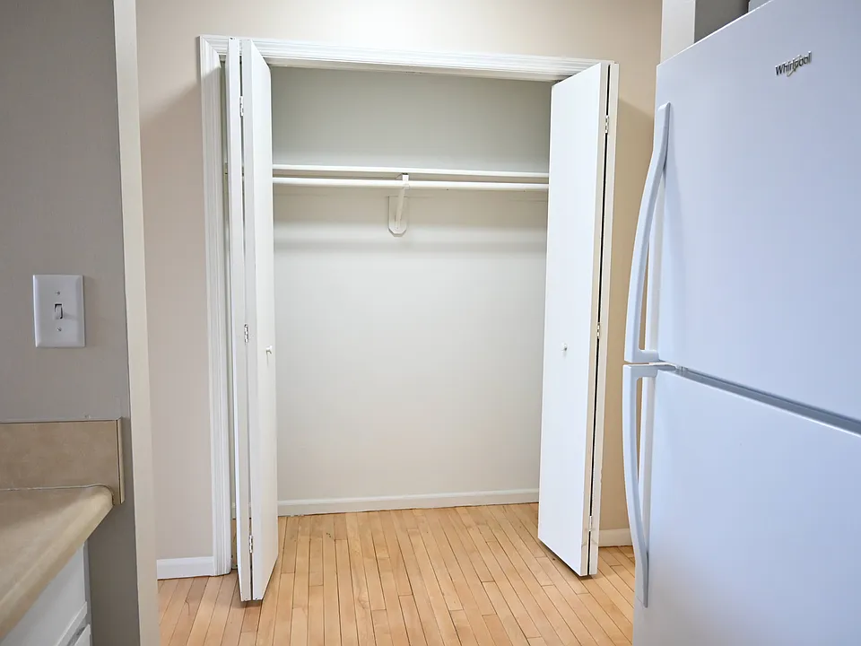 Hallways closet next to kitchen.