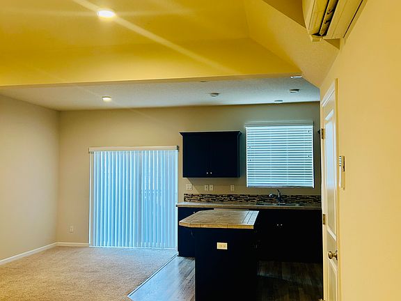 Entrance view to the living room and kitchen and dining area.