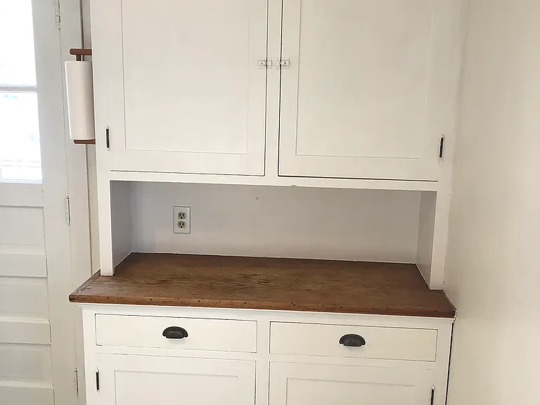 Vintage storage cupboard in kitchen.
Newly refinished wood surface.