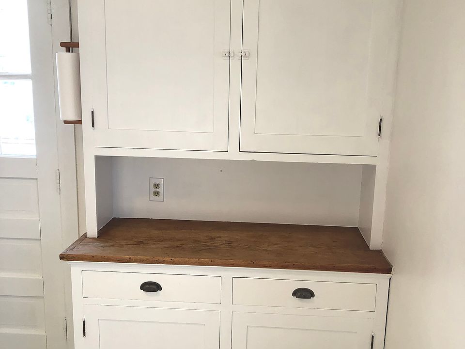 Vintage storage cupboard in kitchen.
Newly refinished wood surface.