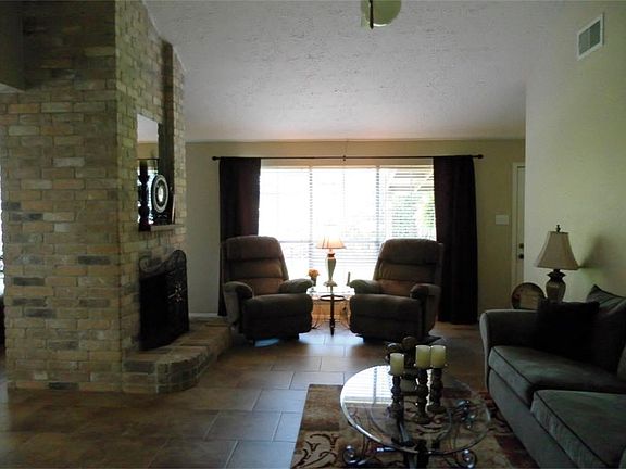 Stunning high ceilings and Italian porcelain tile in den