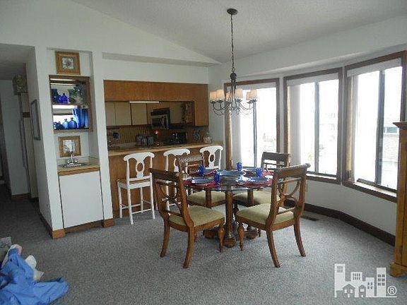 Dining area includes wet bar and breakfast bar.