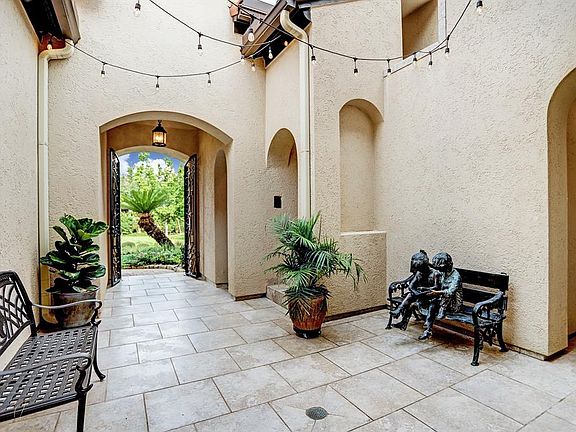 Tranquil courtyard lined with string lights