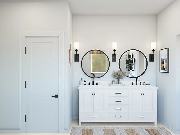 Primary bath with dual sinks and circle mirrors