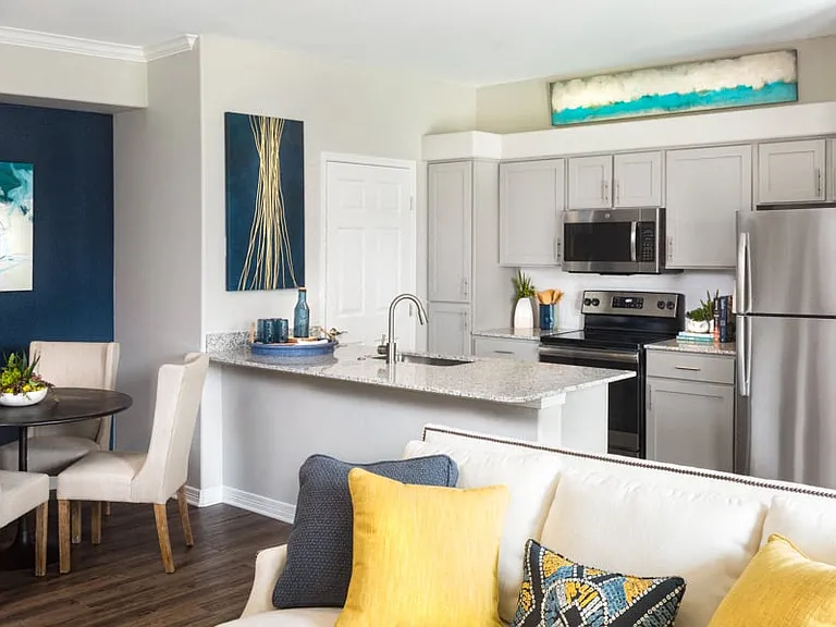 Kitchens feature stainless steel appliances and premium granite countertops