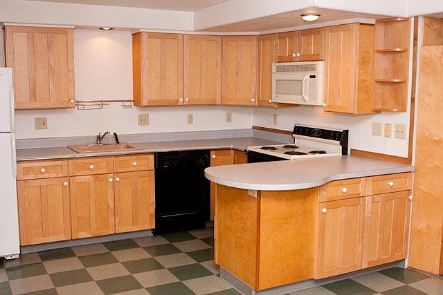 Kitchen has linoleum floor.