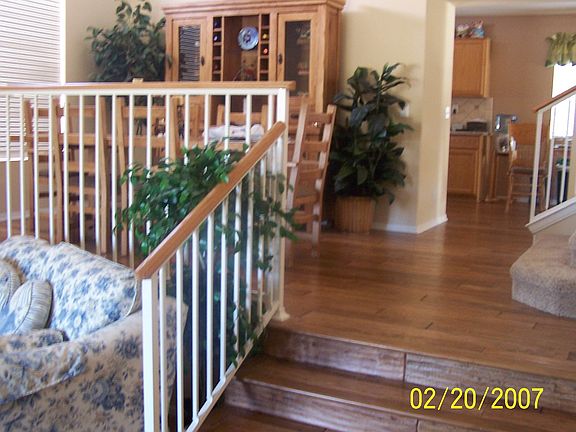 Tri-level, distressed wood floors