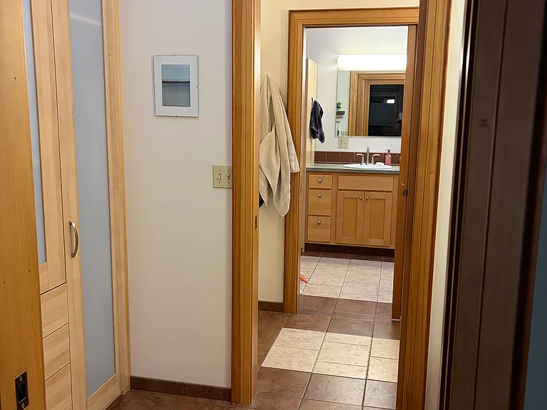 Looking through bathroom from primary bedroom.