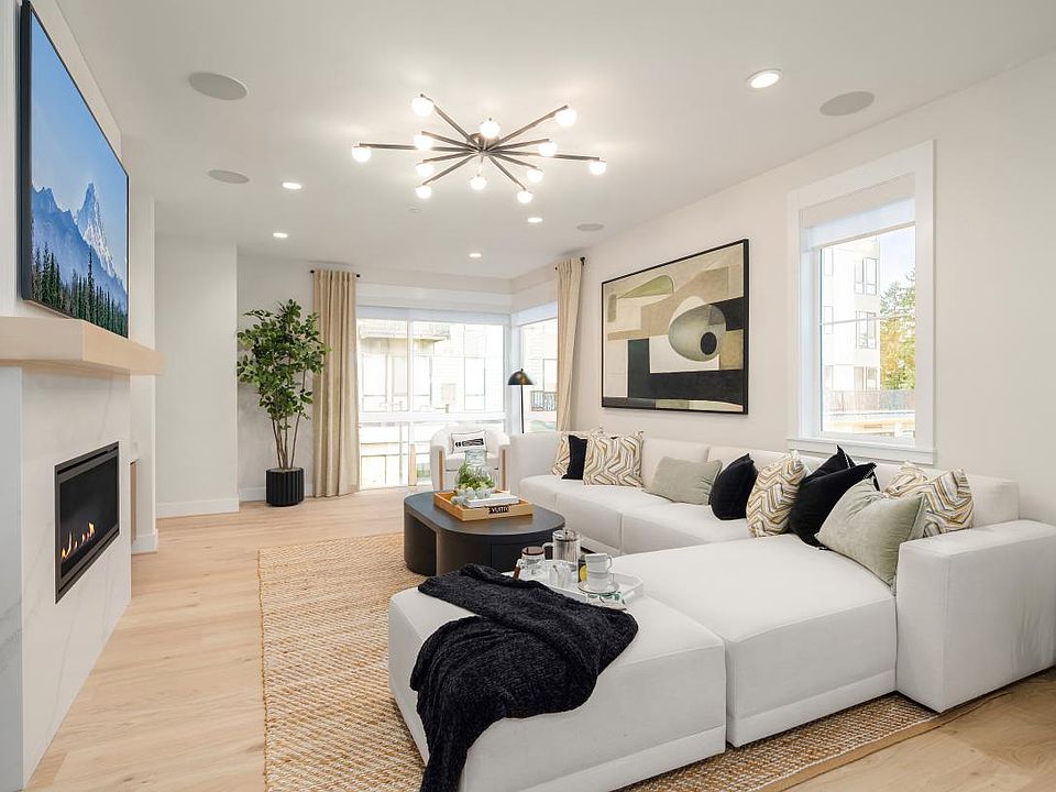 Bright, open great room with floor-to-ceiling corner windows