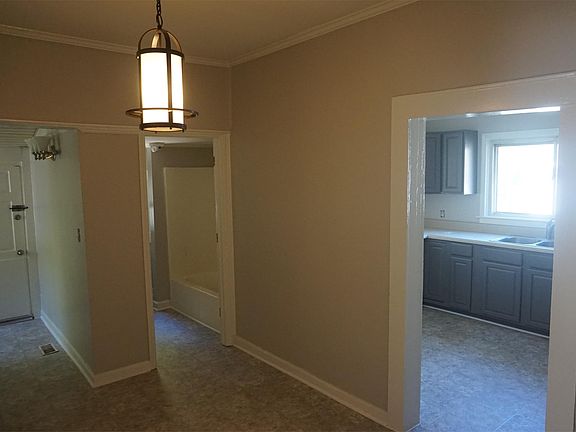 Dining room, full bathroom, kitchen, laundry room with hook