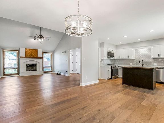 Great room and Kitchen from the Dining room. Harwood floors throughout.