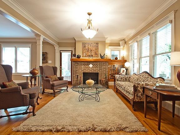 Original Front Formal Living Room, with Wood Burning Fireplace and Hardwood Floors.