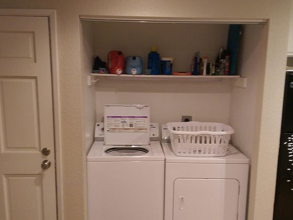 Free in-unit laundry with extra storage. we've since added doors to this.