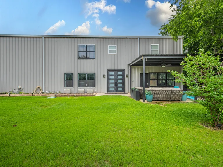 Modern exterior with a clean, open layout and private yard.