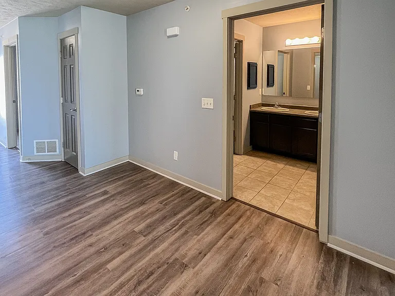 Hall between rooms A and B with bathroom in the middle.