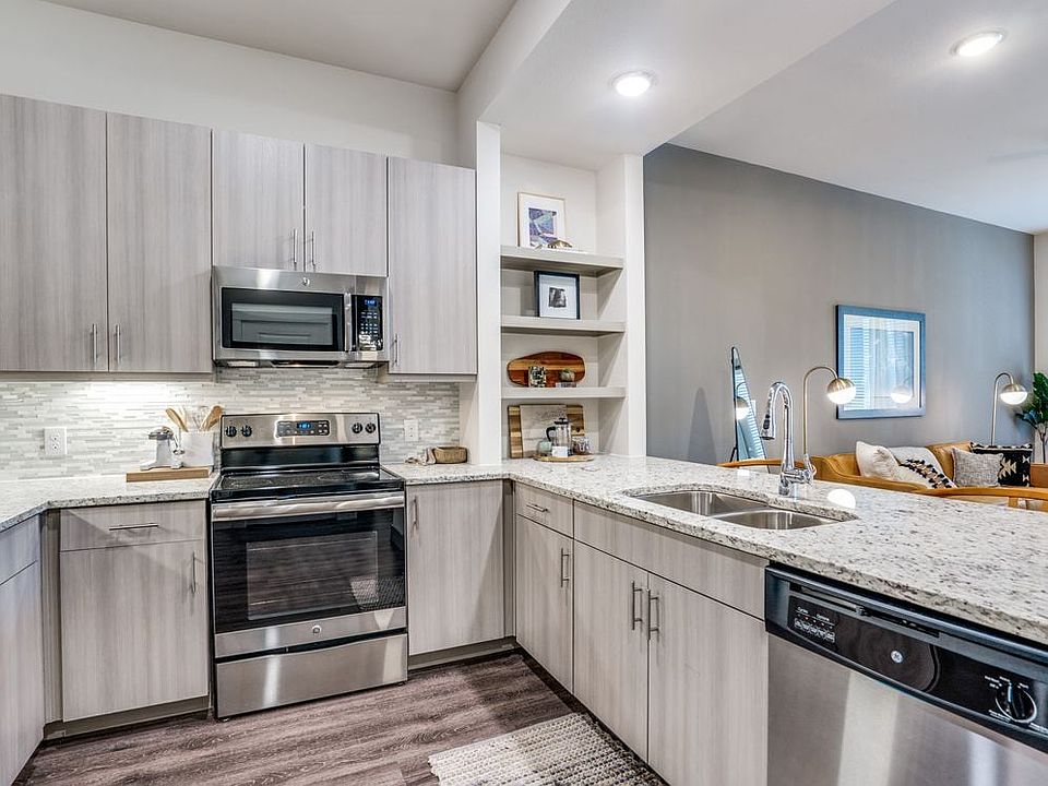 Gray finish package kitchen and dining area with hard surface flooring.