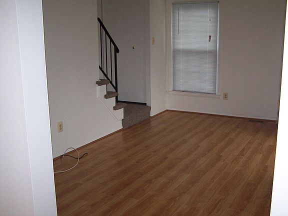 Living Room. Stairs going to second floor to left.
