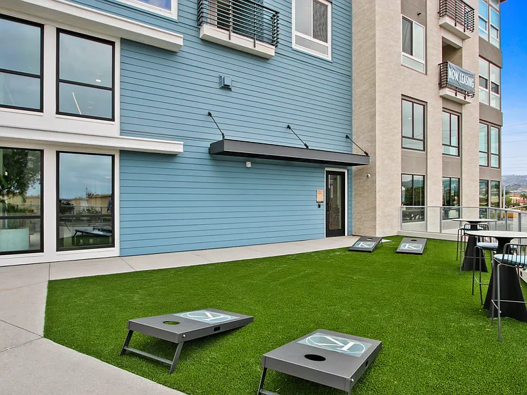 Outdoor patio with cornhole