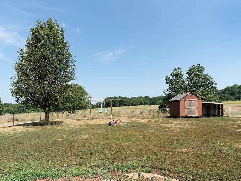 Large fenced in backyard with 10x12 storage building!
TONS of green space behind