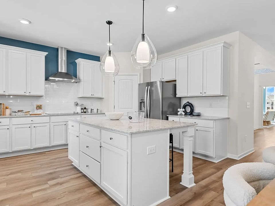 Open-concept kitchen with island, perfect for cooking, dining, and entertaining.