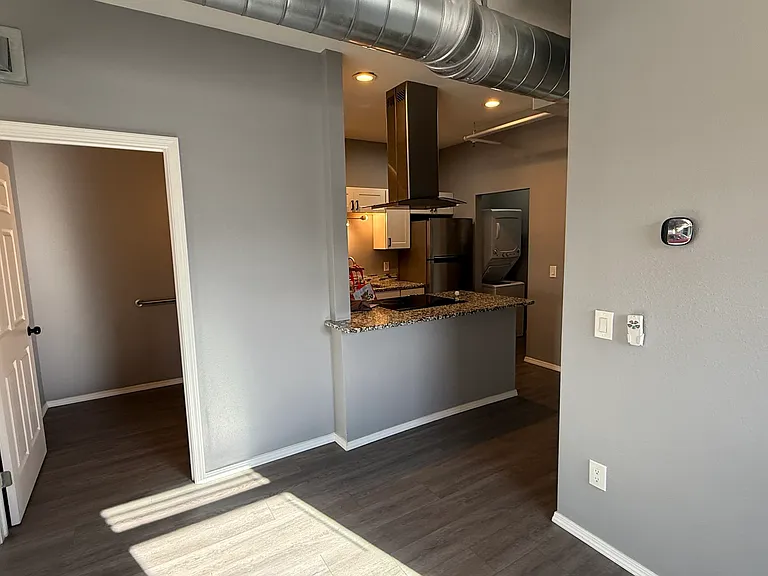 From dining room, front bathroom and kitchen visible